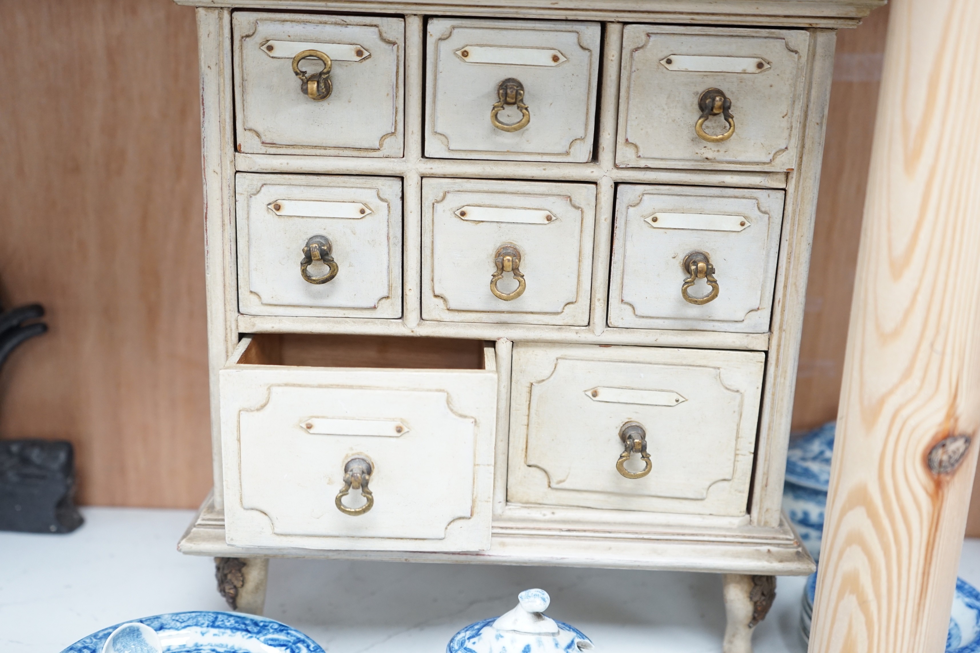 A Victorian toy-size blue and white dinner service and a painted wooden miniature chest, chest 27cms high